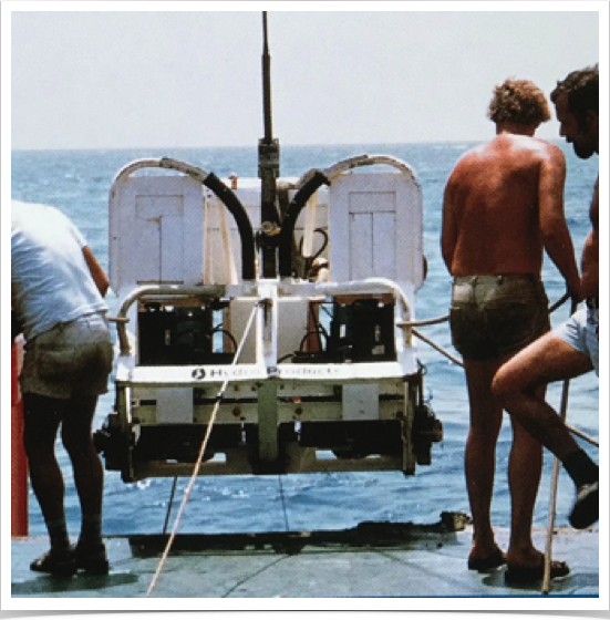 Deploying geological oceanography equipment.
